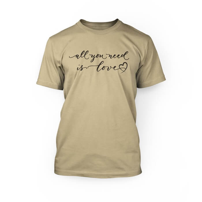 "black all you need is love scripted font with a graphic heart on the front of a soft cream crew neck unisex t-shirt"