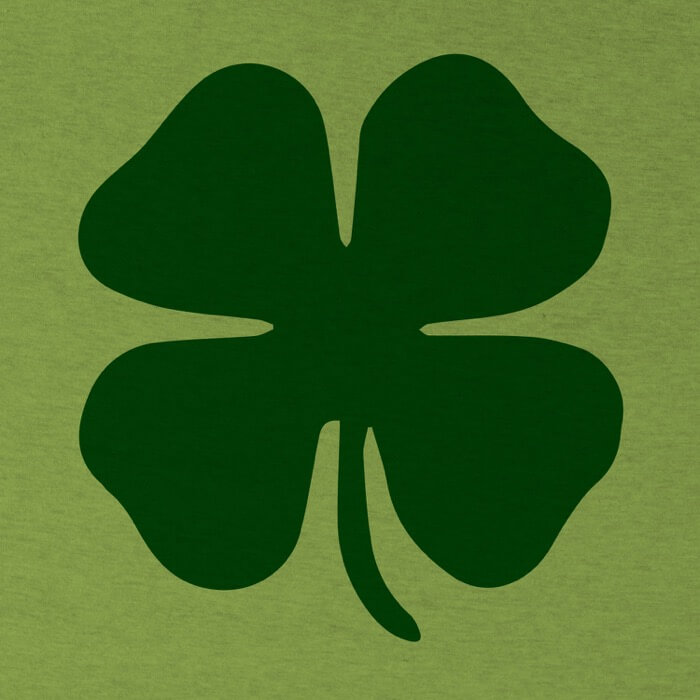 "green clover on the front of a heather green image"